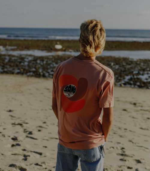 Image Of A Surfer In A Wetsuit