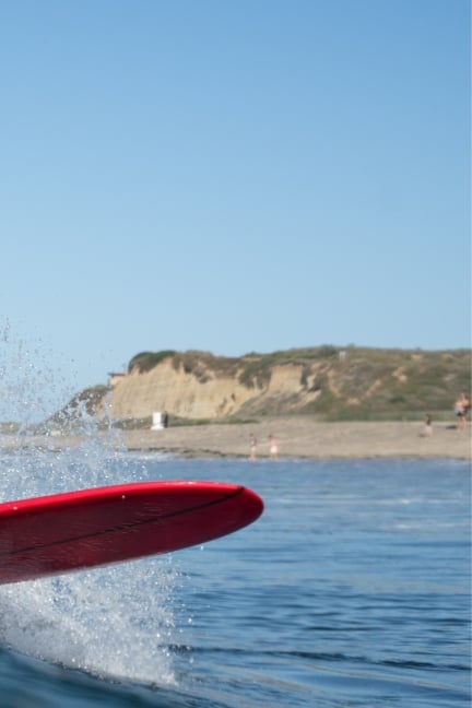 Image of a wave and surfboard