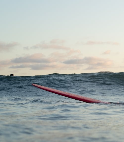 Image Of A Surfer In A Wetsuit