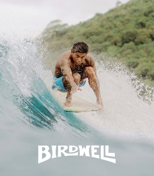 Image Of A Surfer On The Beach